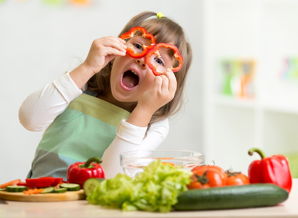 Little Girl Playing Veggies